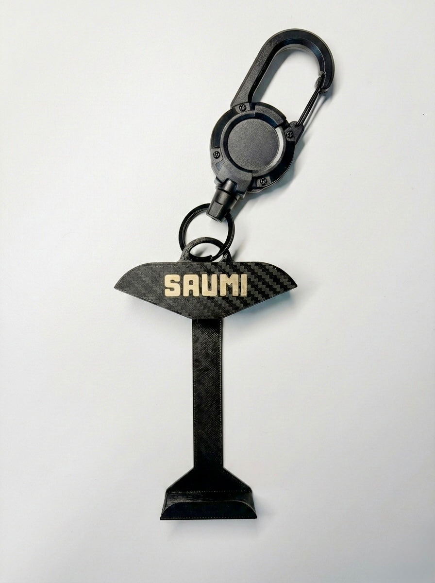 SAUMI Buddy - transport holder for SAUMI with a carbon fiber design and 'SAUMI' branding on a white background